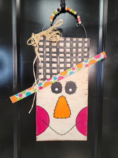 Hand-Painted Scarecrow Face Door Hanger: Fall Decor with Raffia